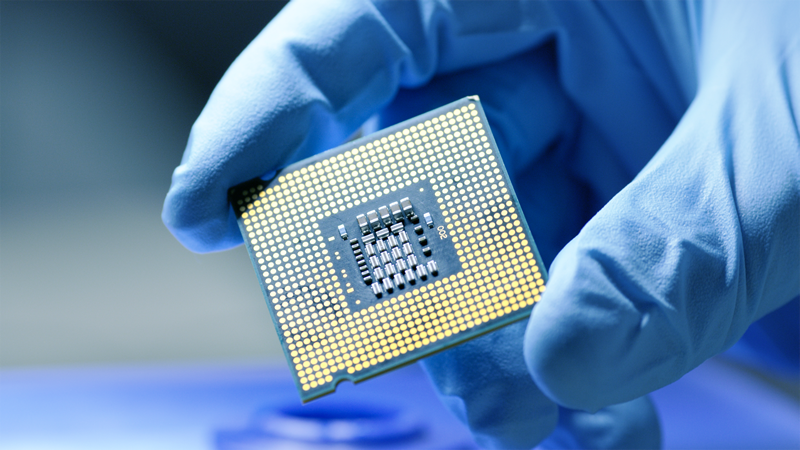 Close up of Computer Chip in gloved hand